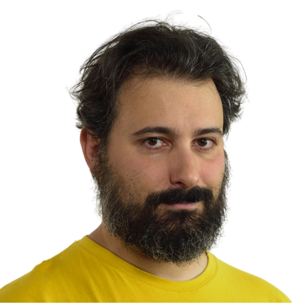 Francesco Fullone uomo con maglia gialla con barba lunga e capelli corti